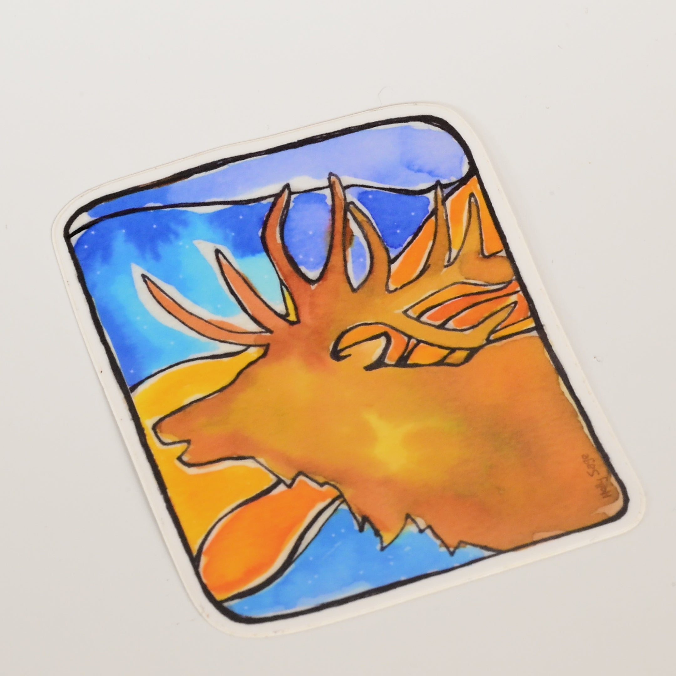 Sticker with a colorful design of a elk head on a blue and orange background