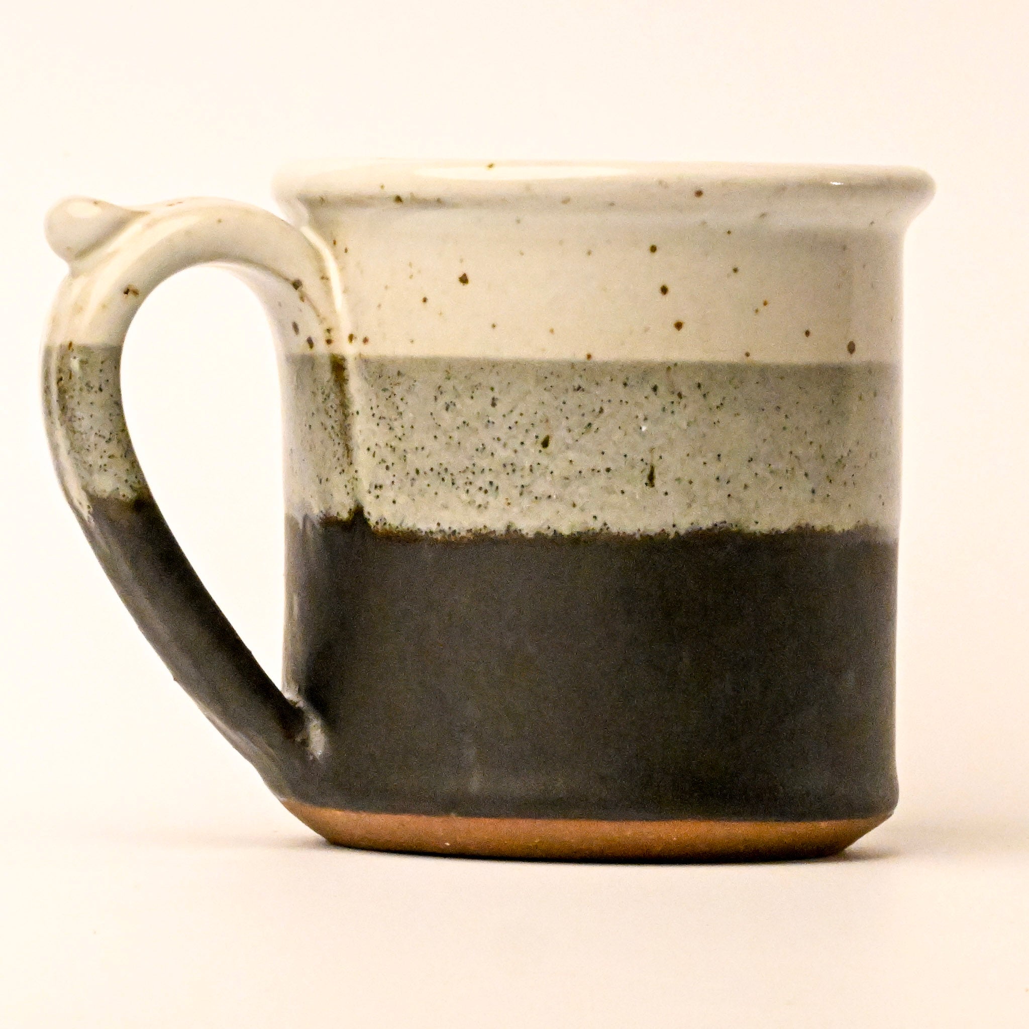 Ceramic mug with two-tone design on a white background