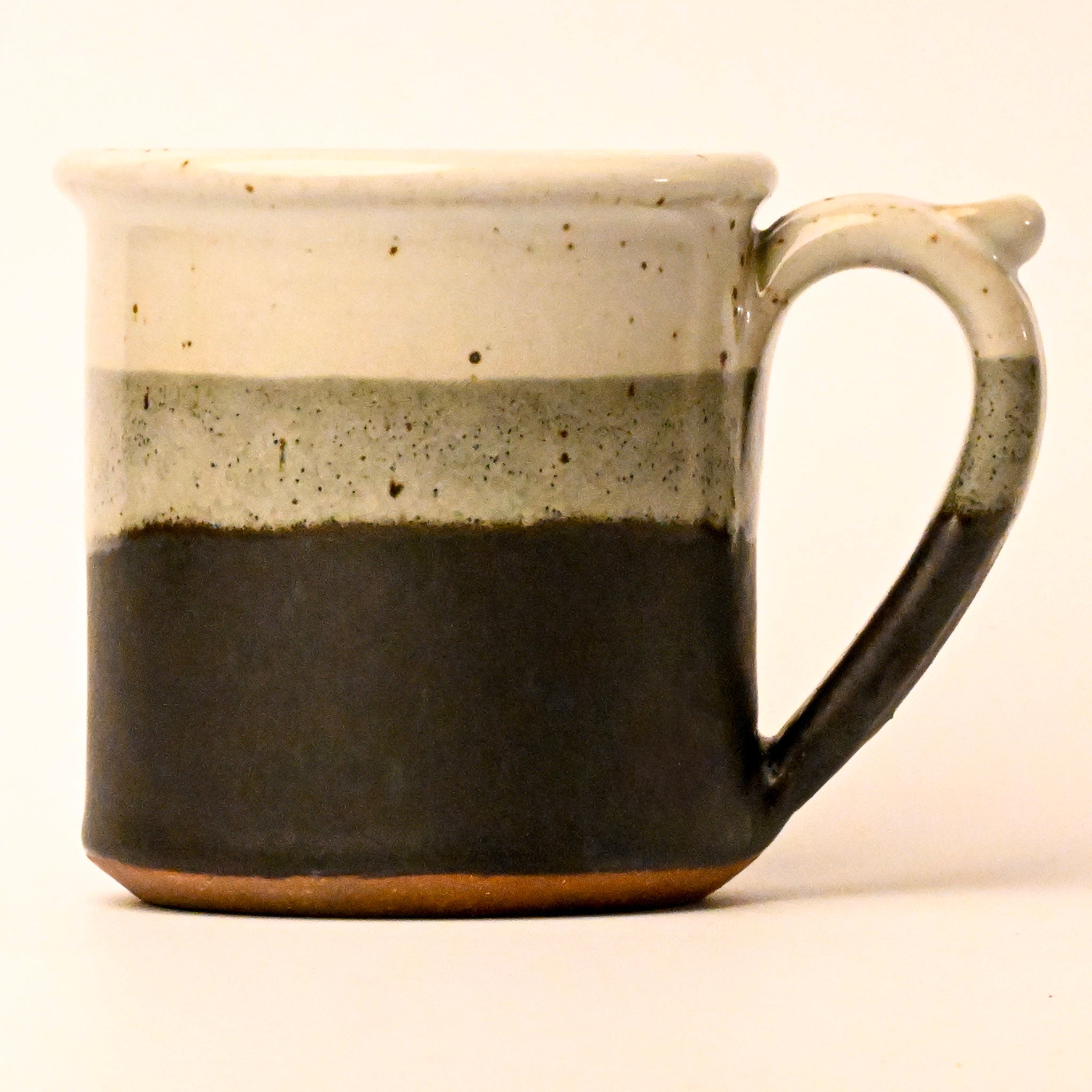 Ceramic mug with two-tone design on a white background