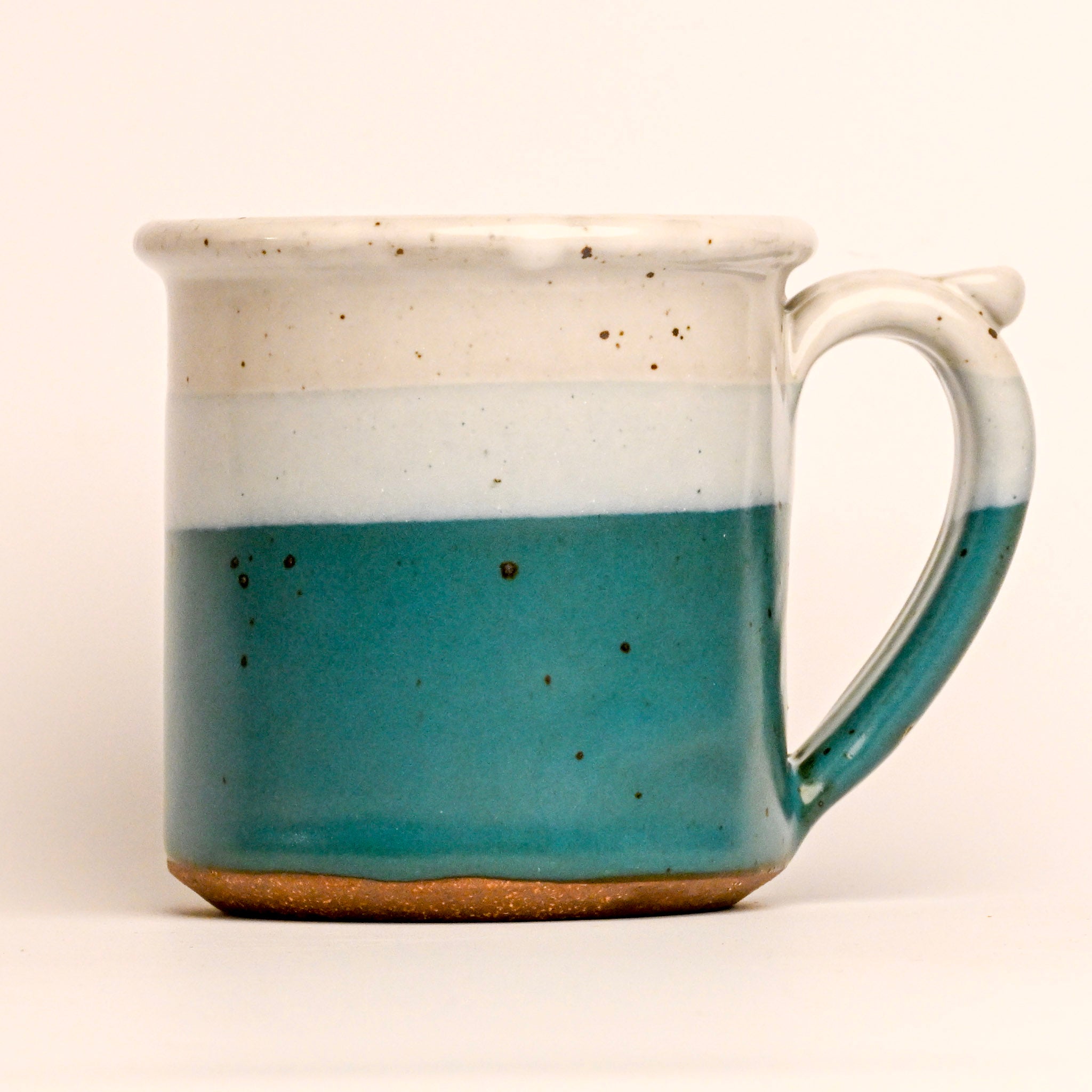 Ceramic mug with two-tone design on a white background