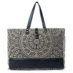 Patterned tote bag with black accents on a white background
