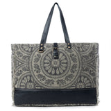 Patterned tote bag with black accents on a white background