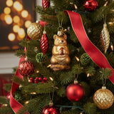 Chipmunk ornament holding an acorn on a white background