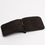 A espresso brown textured leather money clip wallet with a gold-tone metal clip and zipper pull, shown on a clean white background.