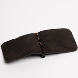 A espresso brown textured leather money clip wallet with a gold-tone metal clip and zipper pull, shown on a clean white background.