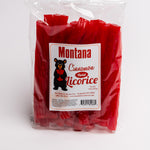 A clear plastic bag of red licorice candy with a white front label reading 'Montana Cinnamon Twist Licorice' and a black bear logo, photographed on a white background.