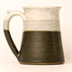 Ceramic mug with a two-tone design on a white background