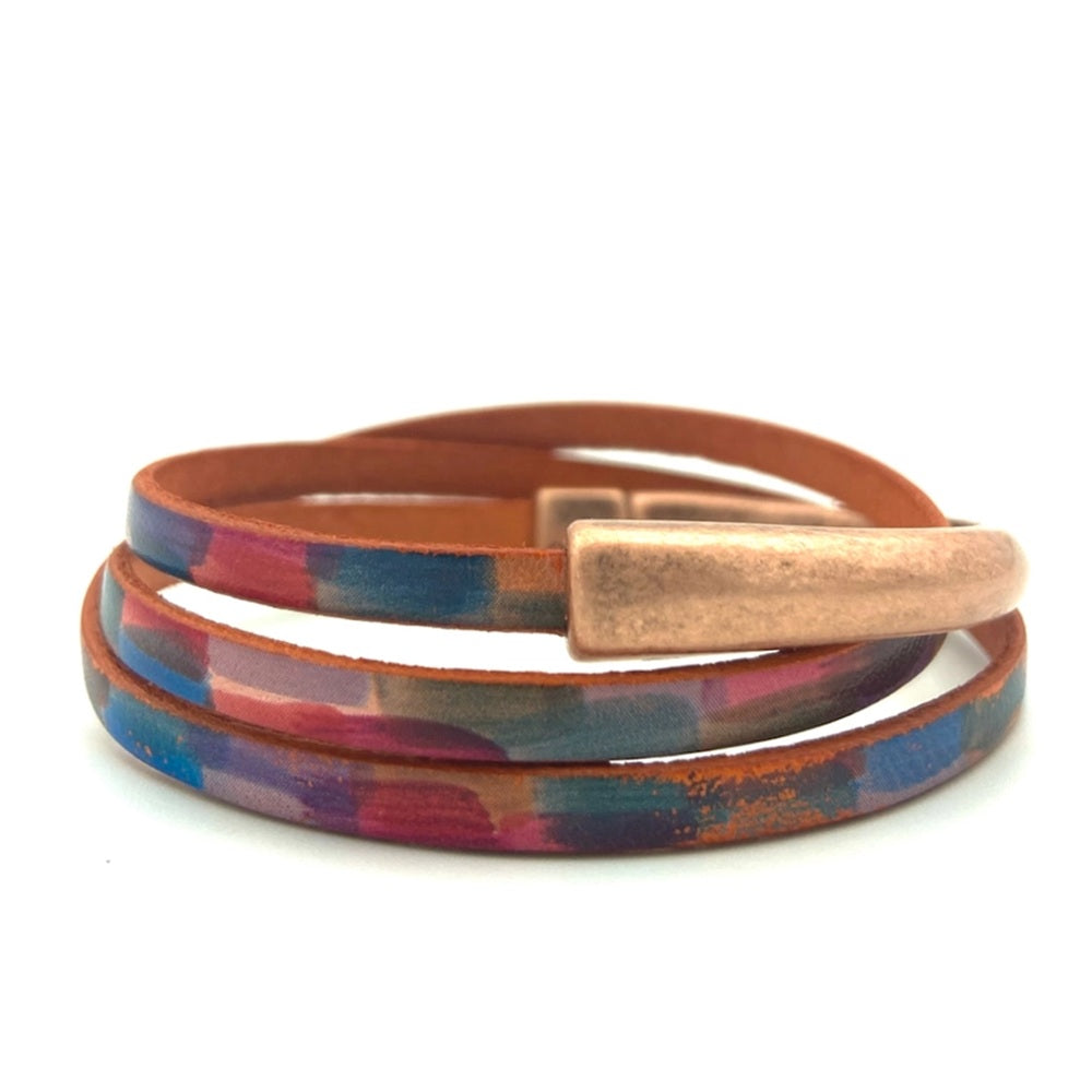 Multicolored wrap bracelet with a copper clasp on a white background