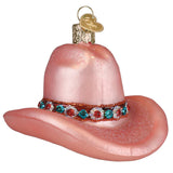 Pink cowboy hat ornament with gemstone band on a white background