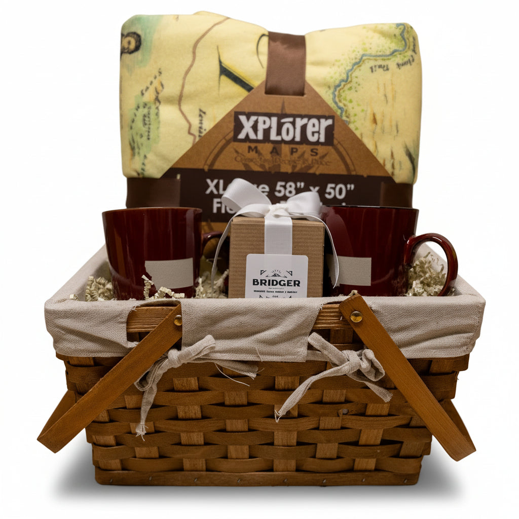 Gift basket with mug, box, and map in a woven basket on a neutral background