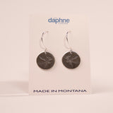 Pair of silver earrings on a Daphne Lorna branded card with 'Made in Montana' text.