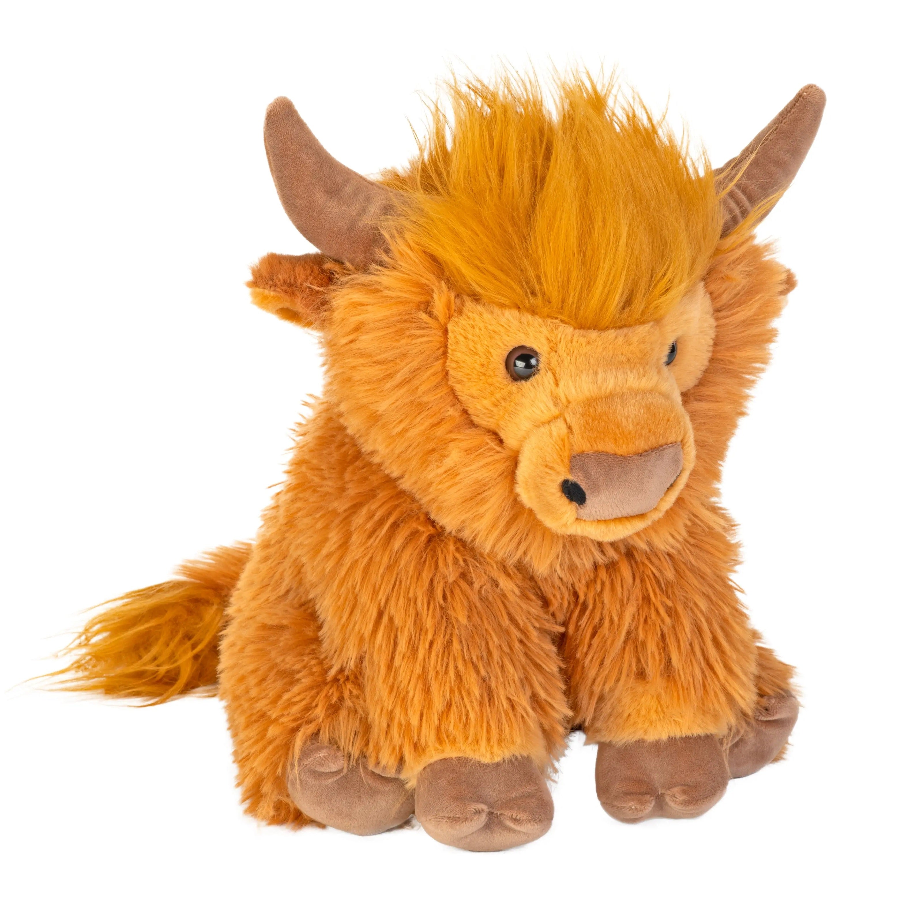 Plush toy of a brown and orange highland cow on a white background