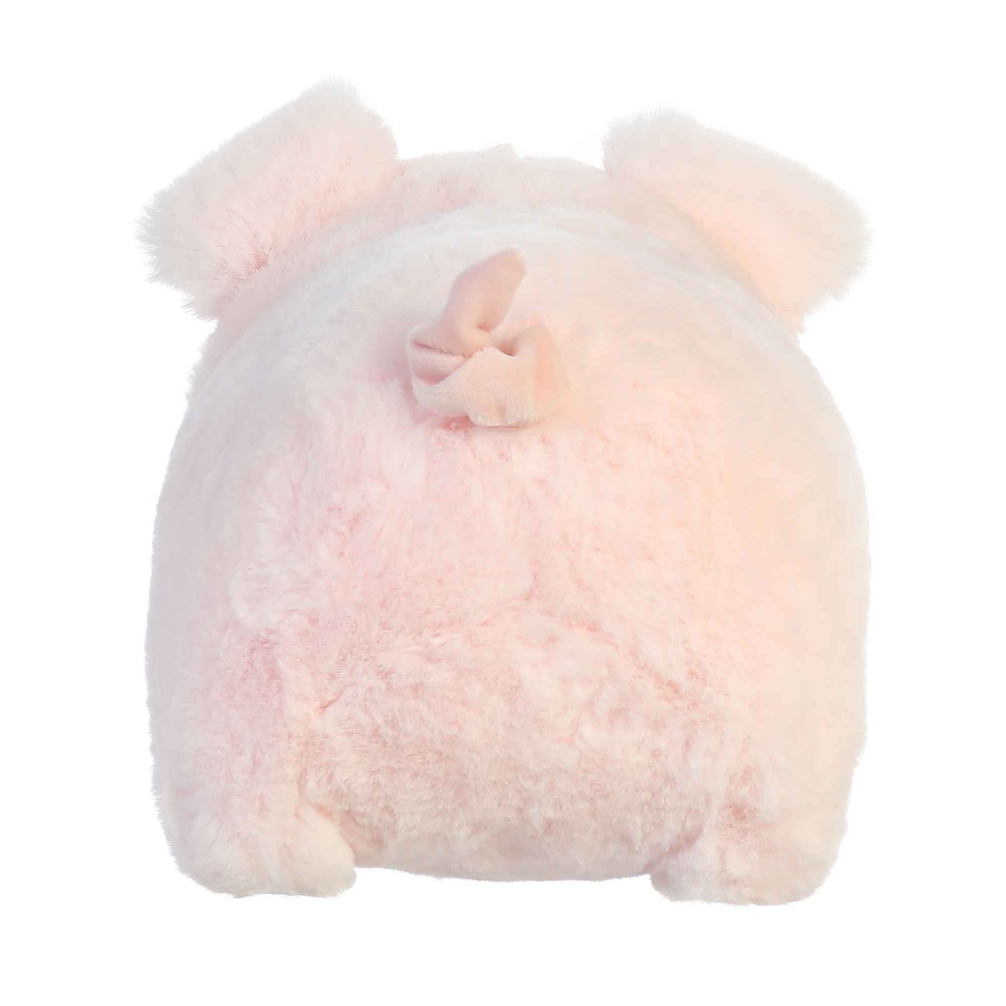 Pink plush toy with a bow on a white background