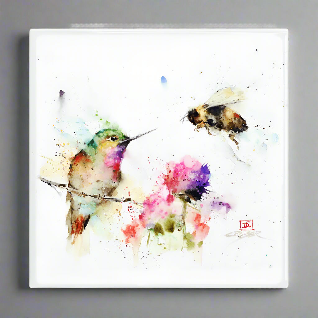 The Garden Visitors Metal Box Wall Art by Meissenburg Designs features a watercolor hummingbird, flower, and honeybee all against a white metal background