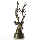 Bronze deer head ornament on a white background