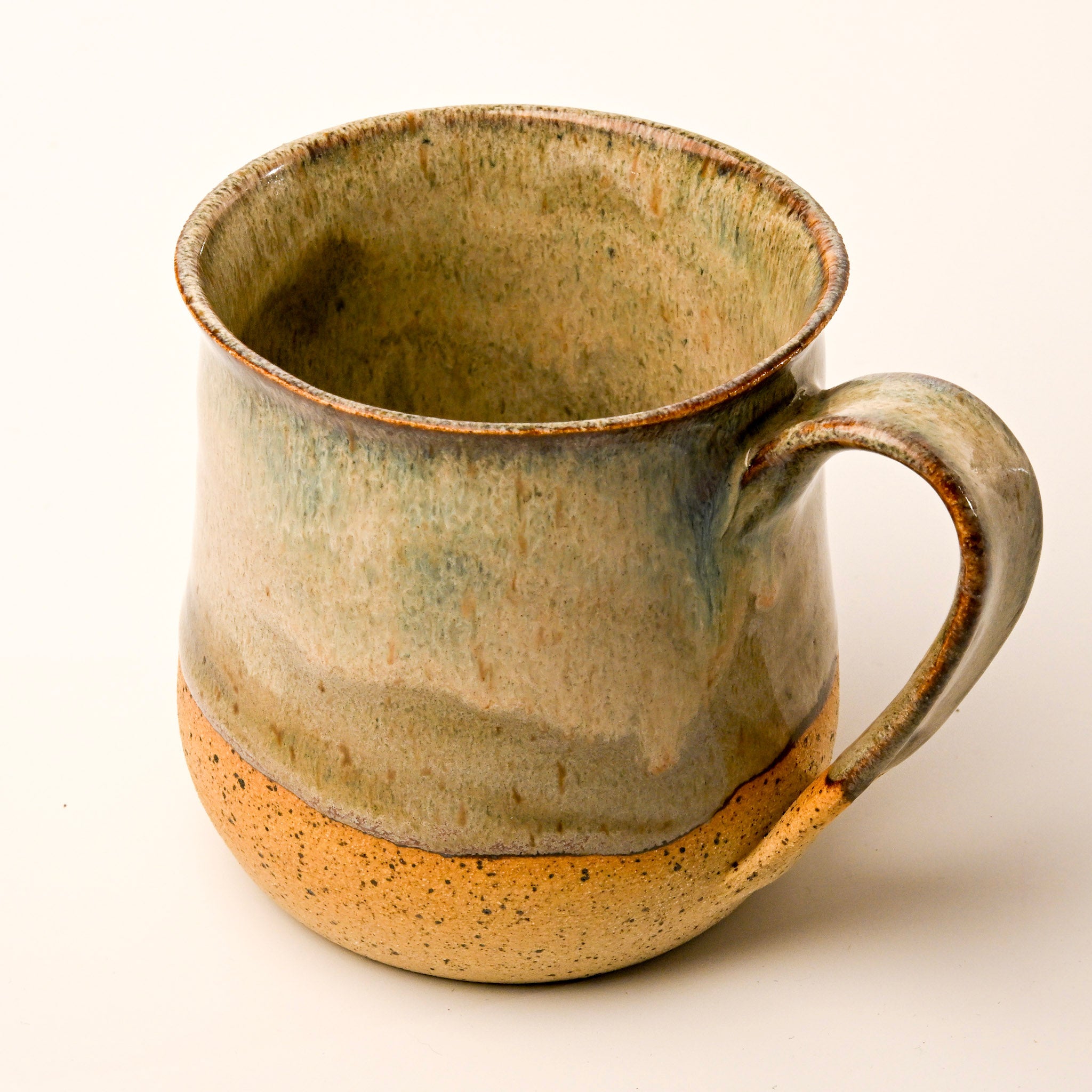 Ceramic mug with a rustic finish on a white background