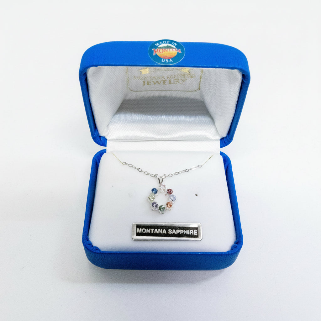 Jewelry box with a necklace labeled 'Montana Sapphire' on a white background