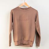 Brown sweatshirt with 'Montana' logo on a hanger against a white background