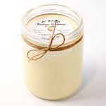 Jar candle with twine bow and 'Montana Farmhouse Candles' label on a white background