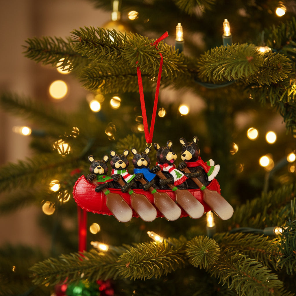 Ornament of four bears in a red canoe with paddles