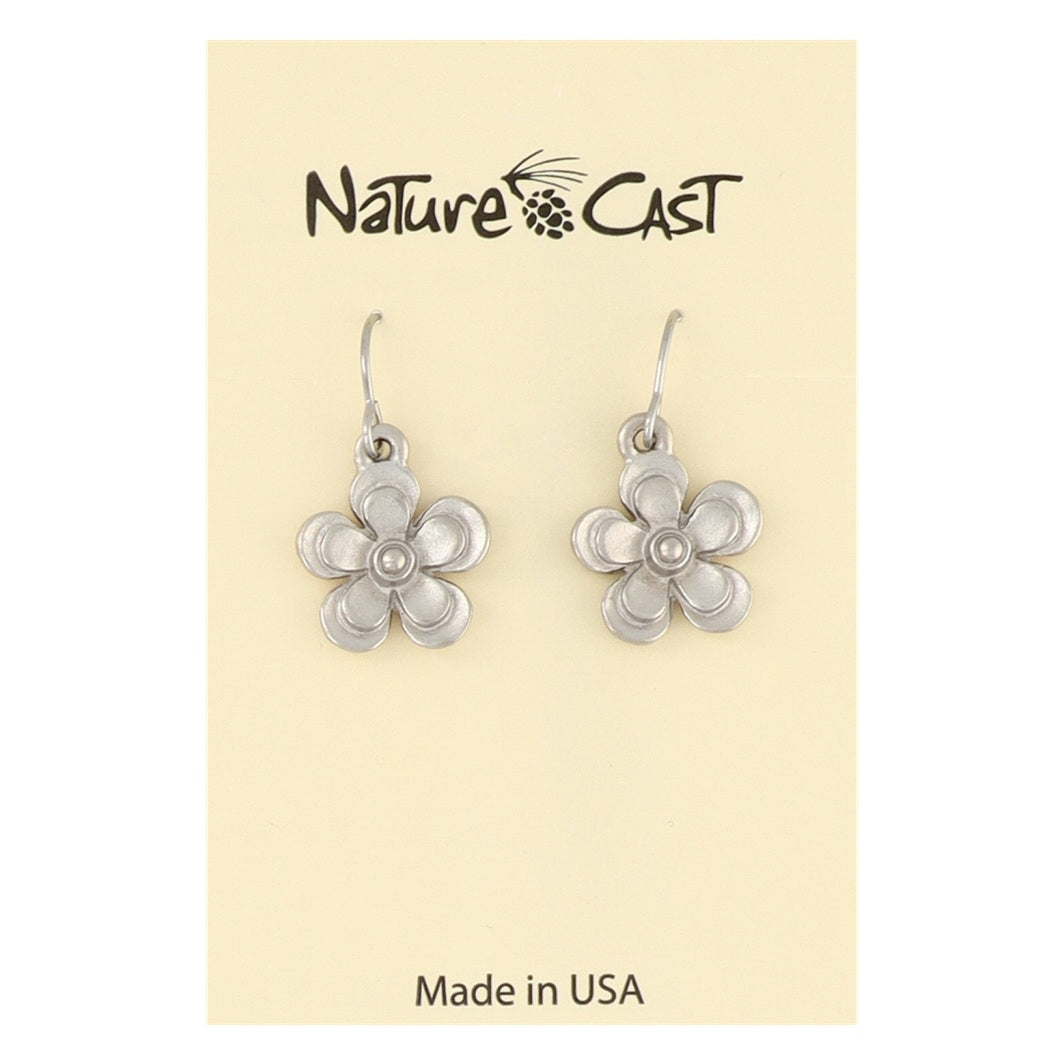 Silver flower-shaped earrings on a beige card with 'Nature Cast' branding.