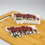 Sponge with floral design on a wooden cutting board