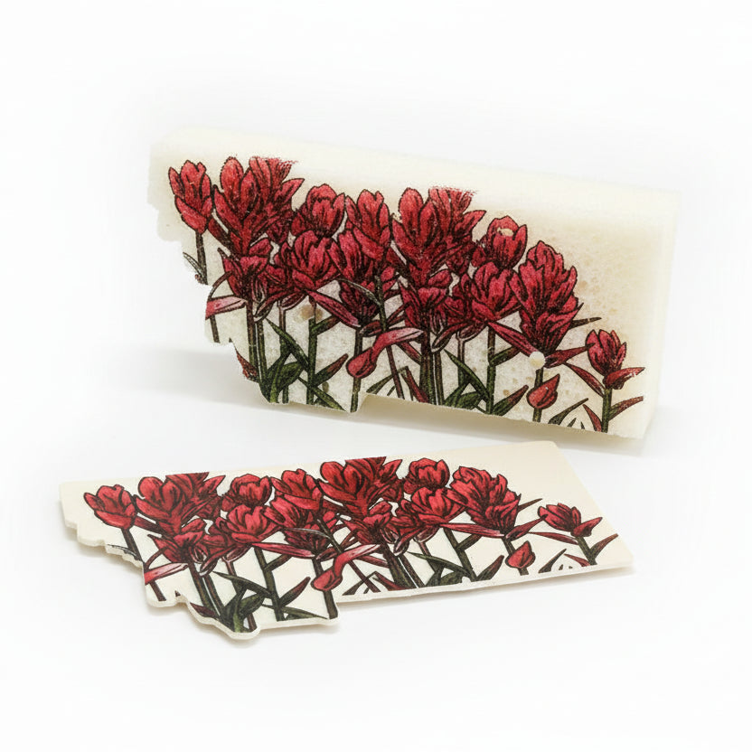 Sponge with floral design on a wooden cutting board