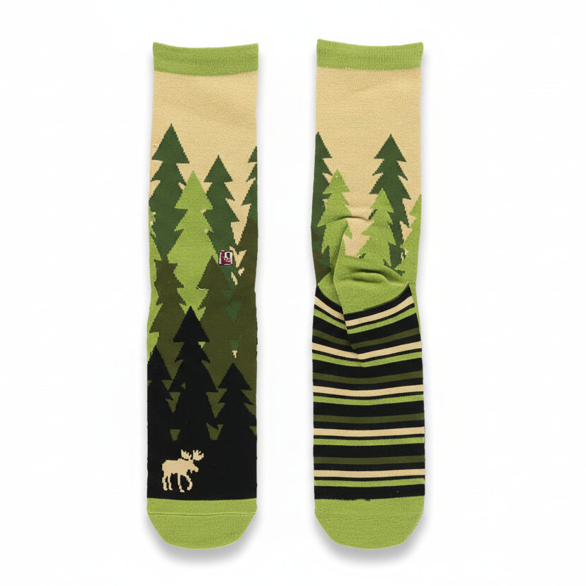 Pair of socks with forest design and striped pattern on a beige background