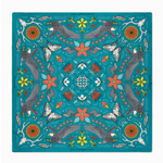 Colorful patterned fabric with birds, flowers, and abstract designs on a blue background