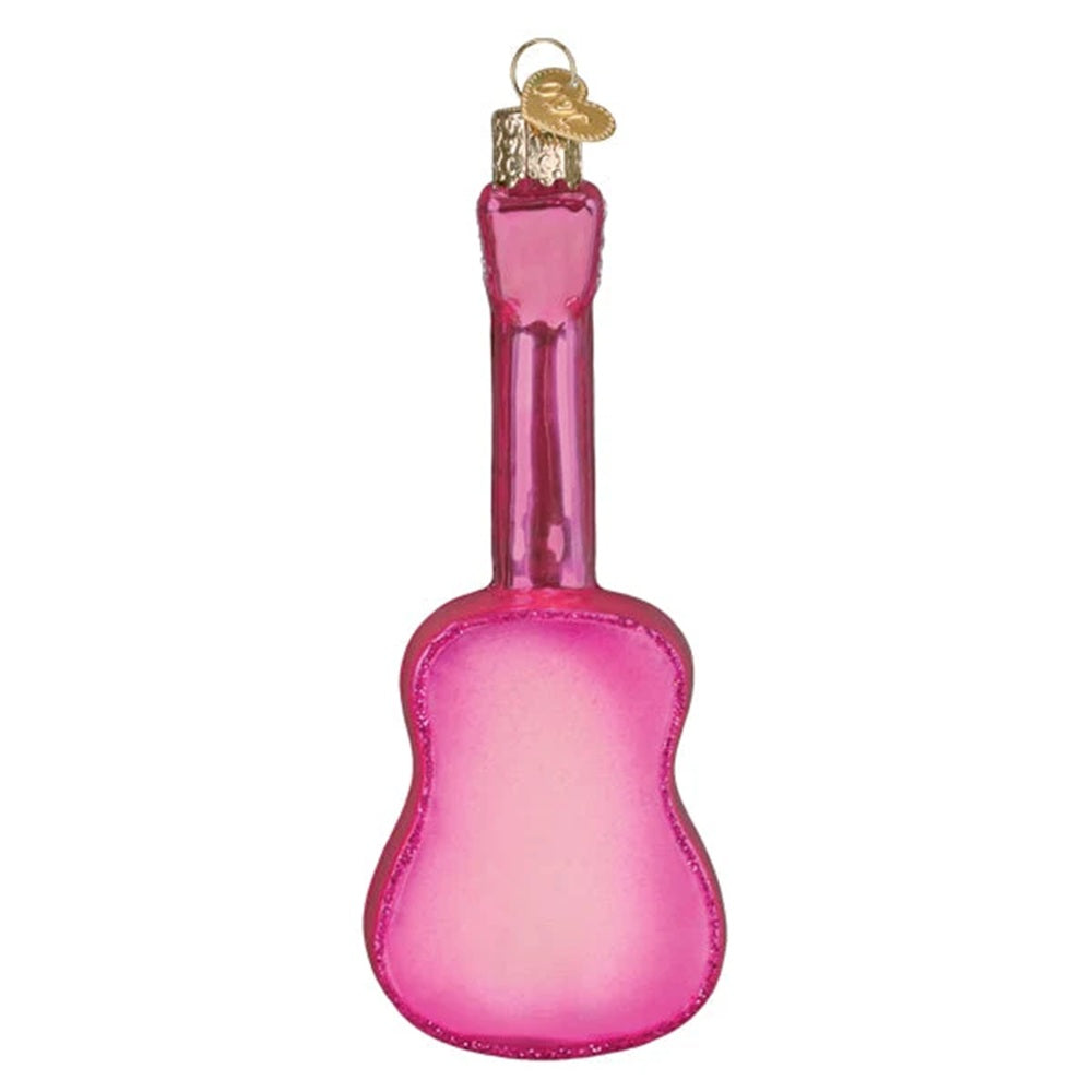 Pink glass guitar ornament on a white background