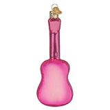 Pink glass guitar ornament on a white background