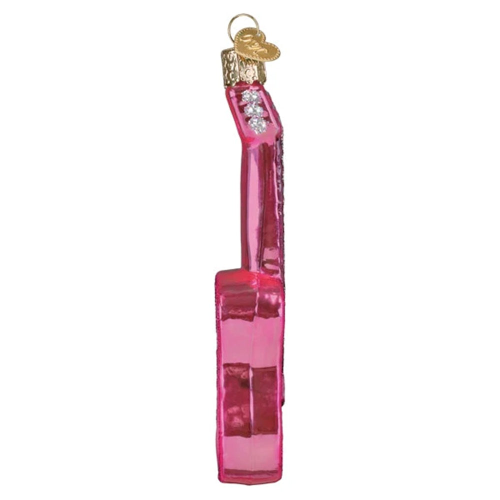 Pink glittery guitar ornament on a white background