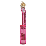 Pink glittery guitar ornament on a white background