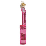 Pink glittery guitar ornament on a white background