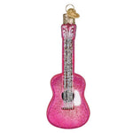 Pink glittery guitar ornament on a white background