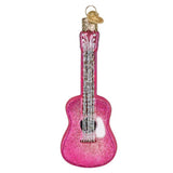 Pink glittery guitar ornament on a white background