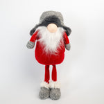 Decorative gnome figurine with red outfit, gray hat, and white beard on a light gray background