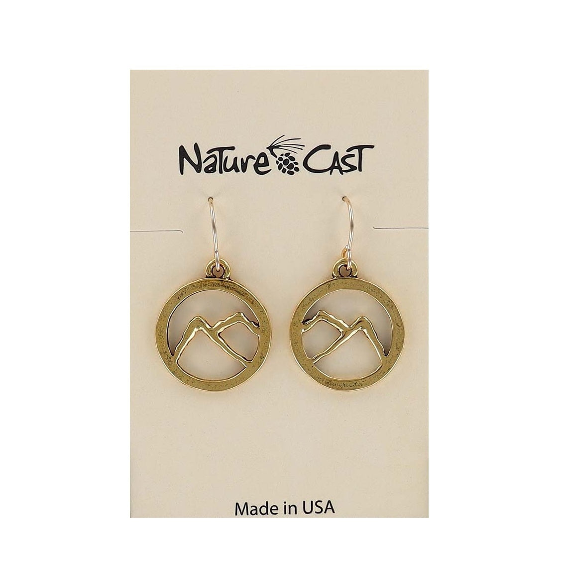 gold earrings with a design of a mountain in a circle. dangling from stainless steel ear wires on a white background