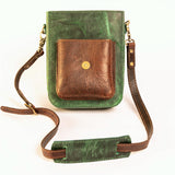 Green and brown leather crossbody bag on a white background