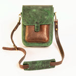 Green and brown leather crossbody bag on a white background