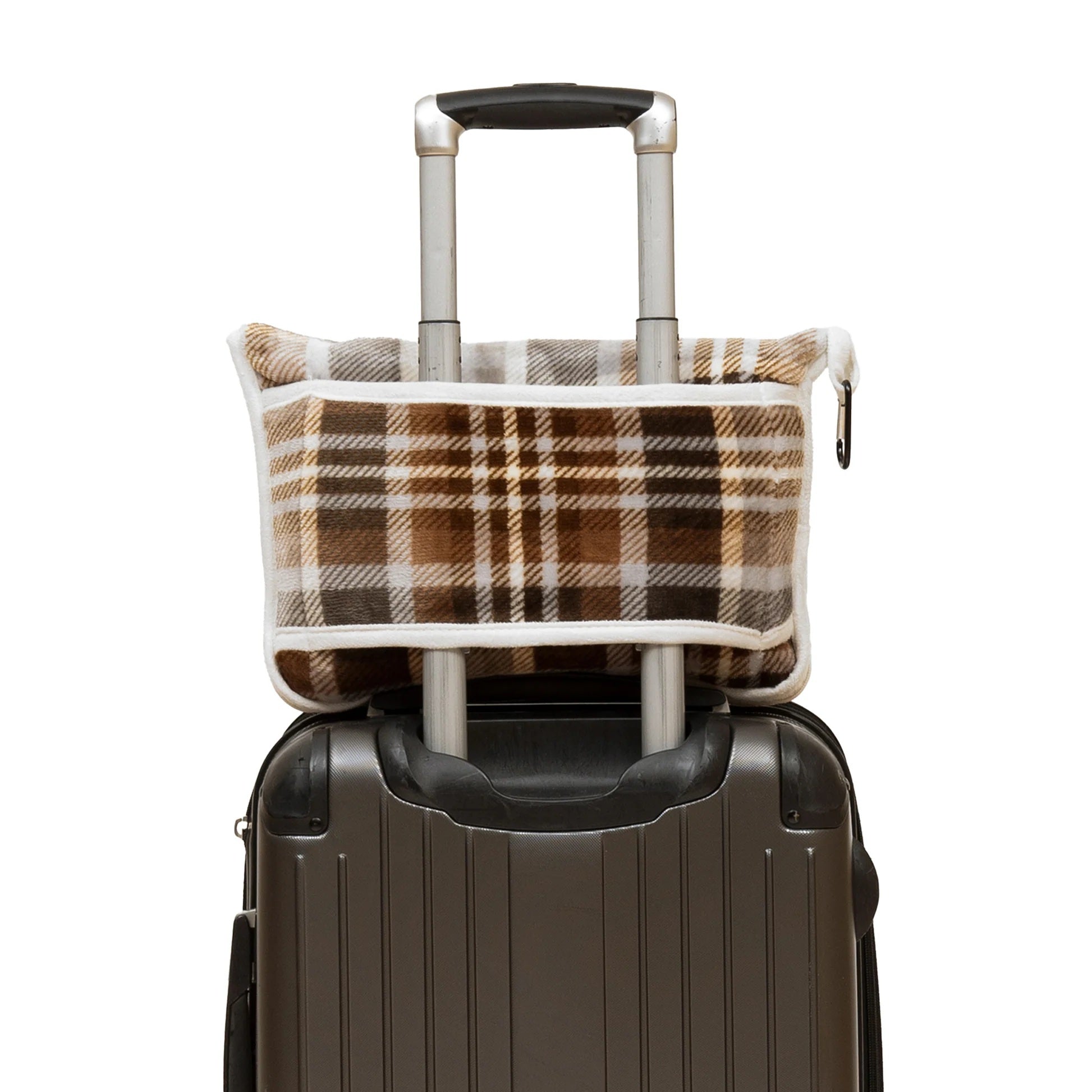Plaid patterned bag attached to a suitcase on a white background