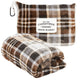 Plaid travel blanket with Carstens Cozies label on a white background