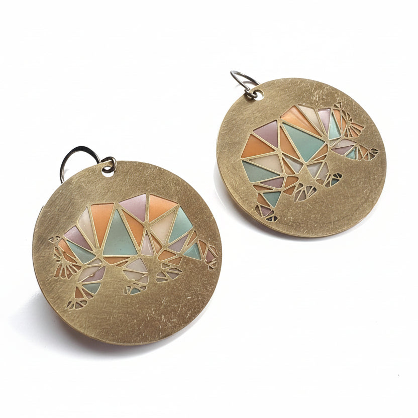 Geometric earrings on a white surface