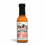 Bottle of Beehive Brothers Habanero Hot Sauce on a white background