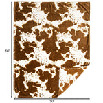 Cow print rug with dimensions 60" x 50" on a white background