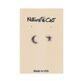 Pair of moon and star earrings on a Nature Cast branded card.
