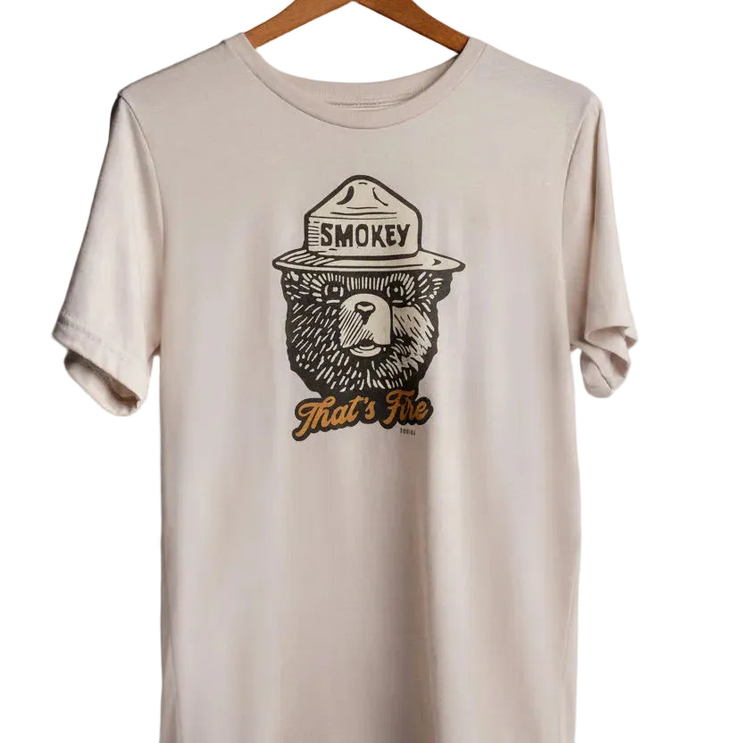 Beige t-shirt with Smokey Bear graphic on a white background