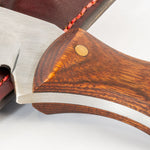 Close-up of a wooden-handled axe with a metallic blade on a light background