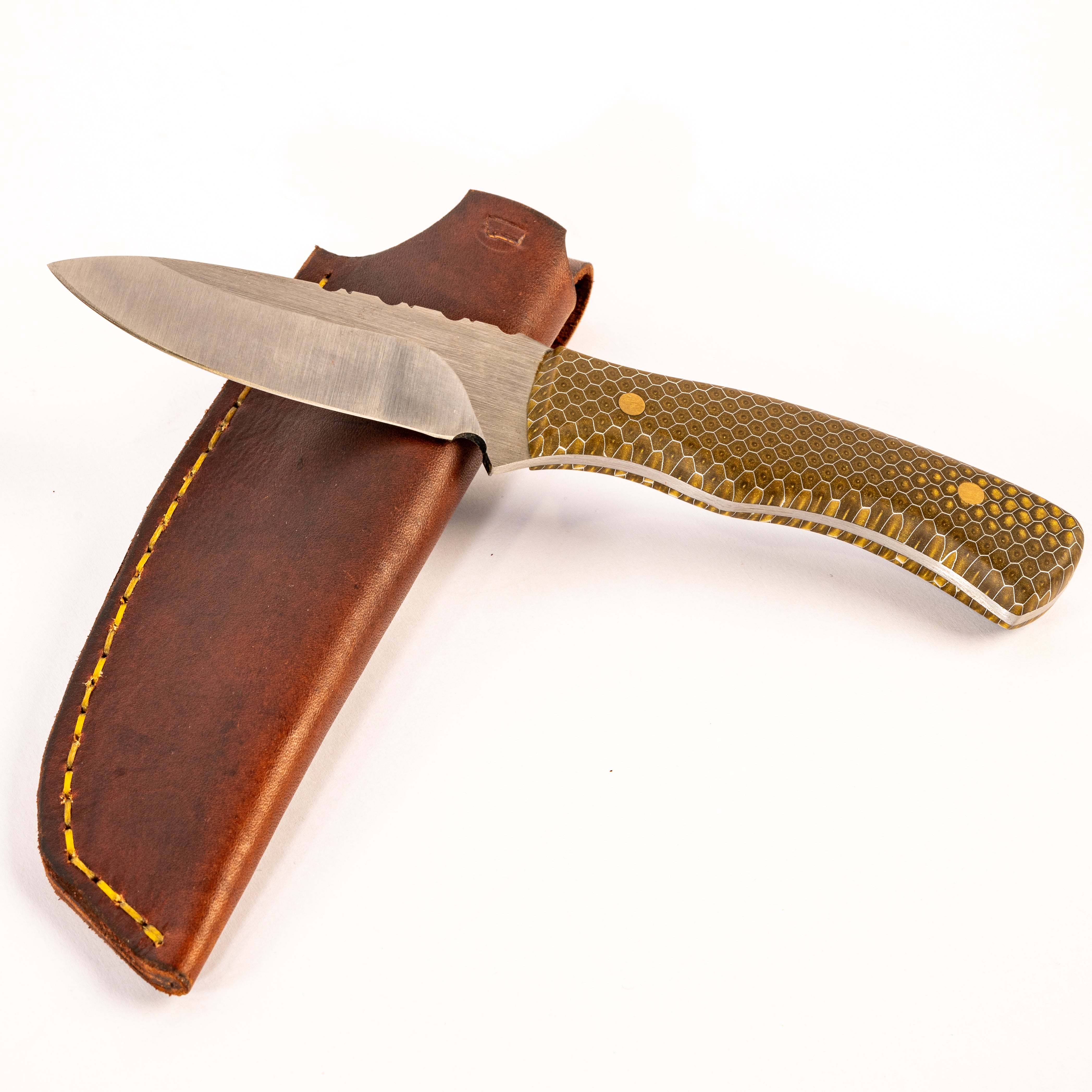 knife with steel blade and honeycomb patterned handle with a leather sheath on a white background