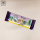 Chocolate candy bar with a purple and yellow wrapper featuring a bear and trees on a beige background.